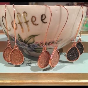 Three pair of rose gold earrings.